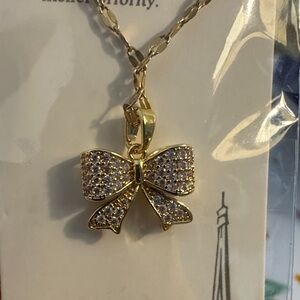 Gold Bow Pendant Necklace with Sparkling Accents